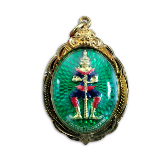 Traditional Thai Buddhist talisman with gold-plated casing and engraved details